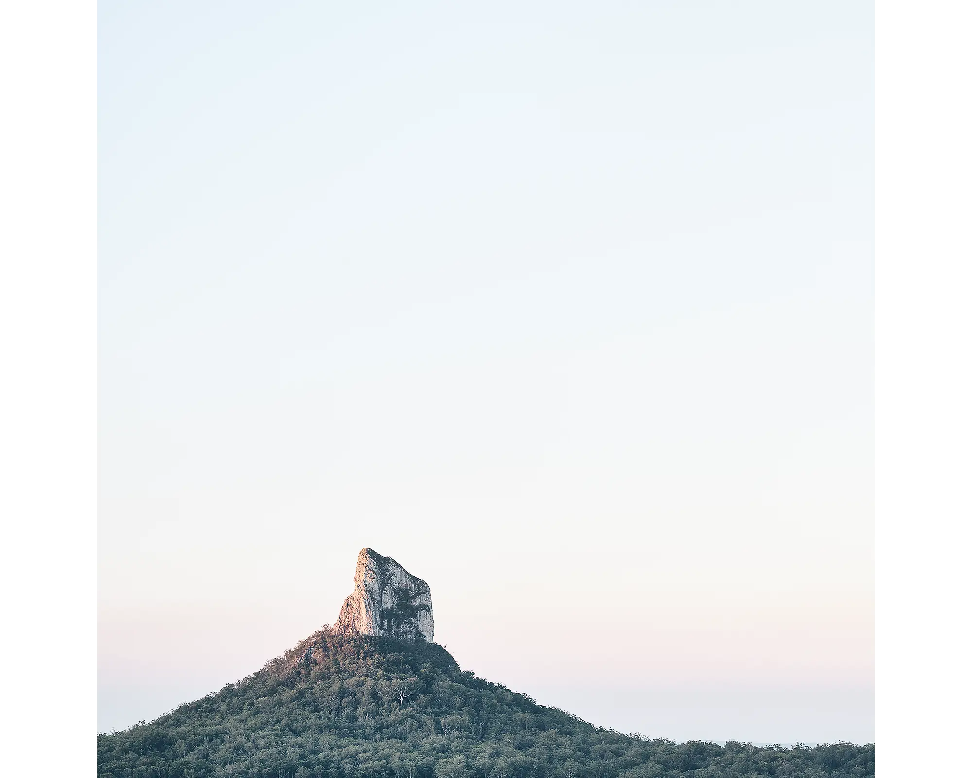 Sunset on Mount Coonowrin, Glasshouse Mountains National Park, Queensland, Australia.