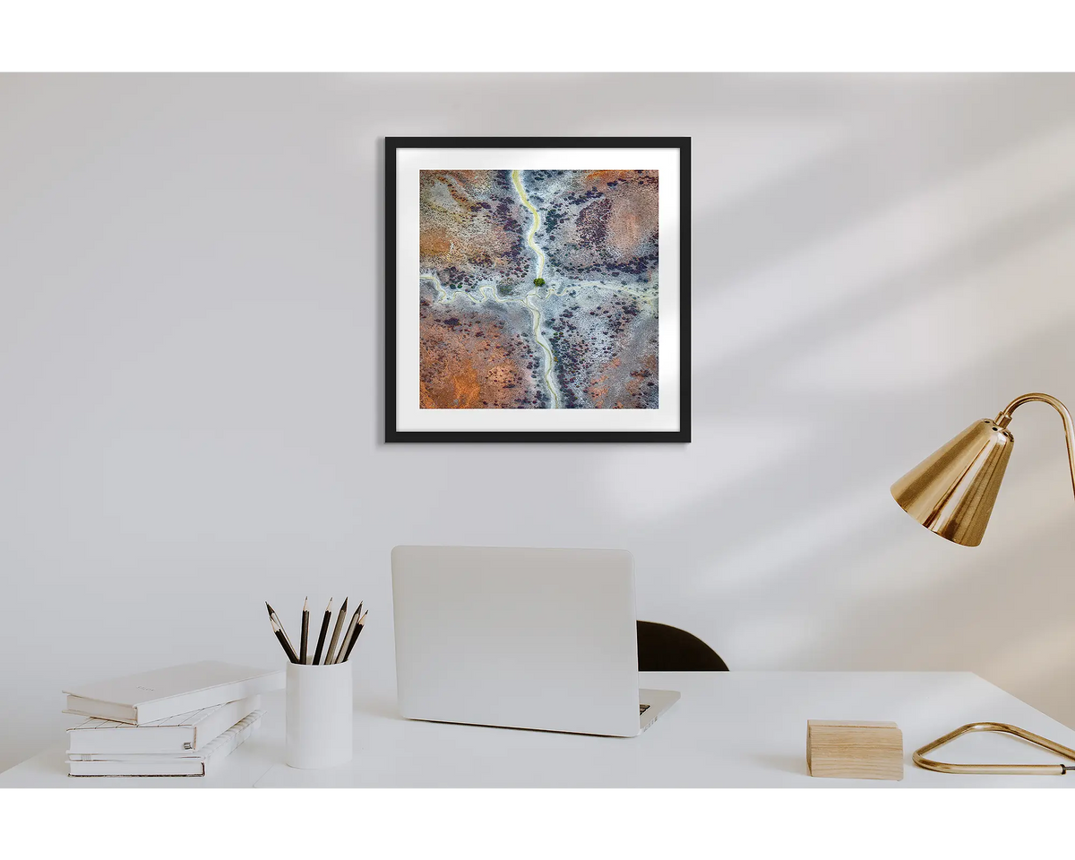 Crossroads. Wall art print of Kimberley abstract patterns, with a black frame in a work from home office.  
