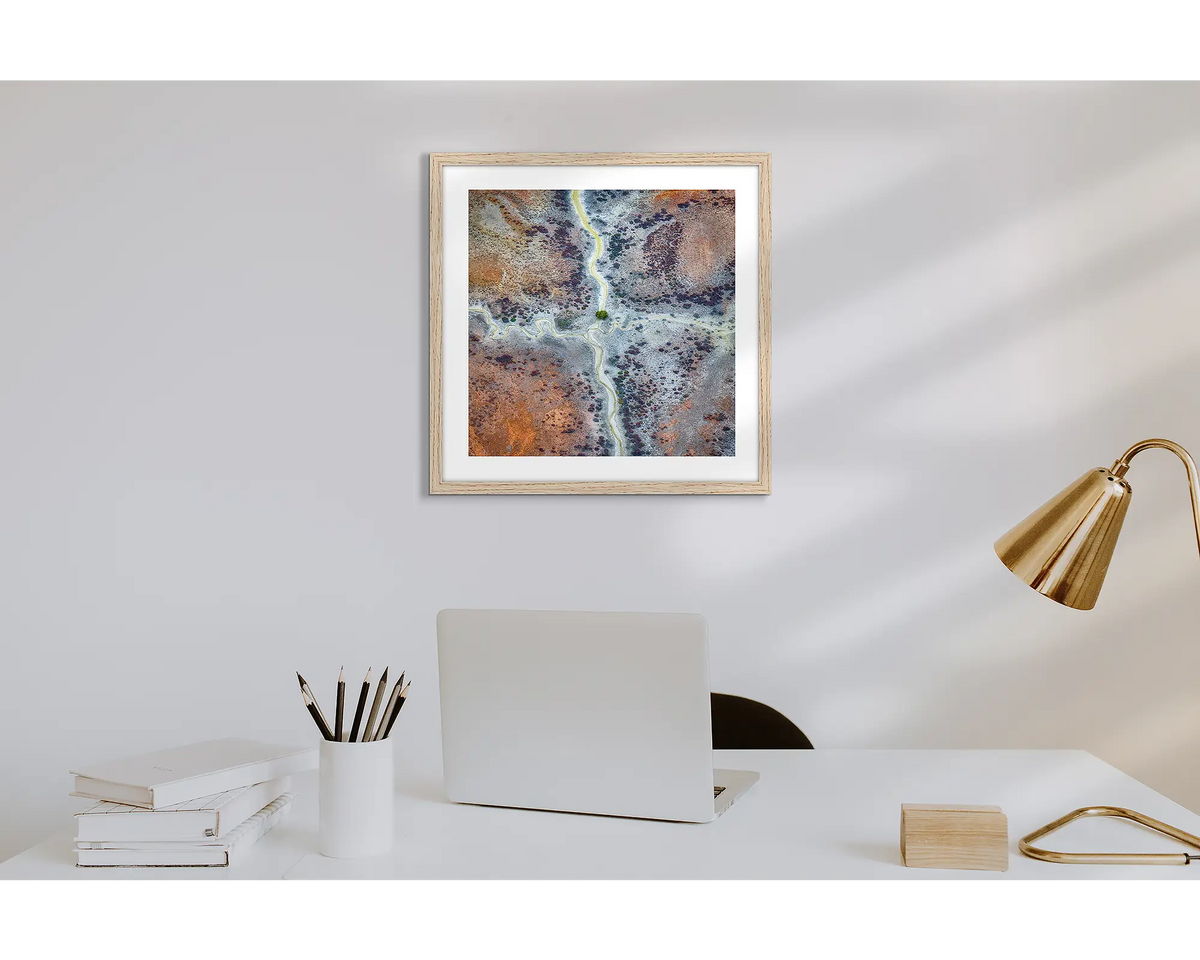 Crossroads. Wall art print of Kimberley abstract patterns, with a timber frame in a work from home office.  