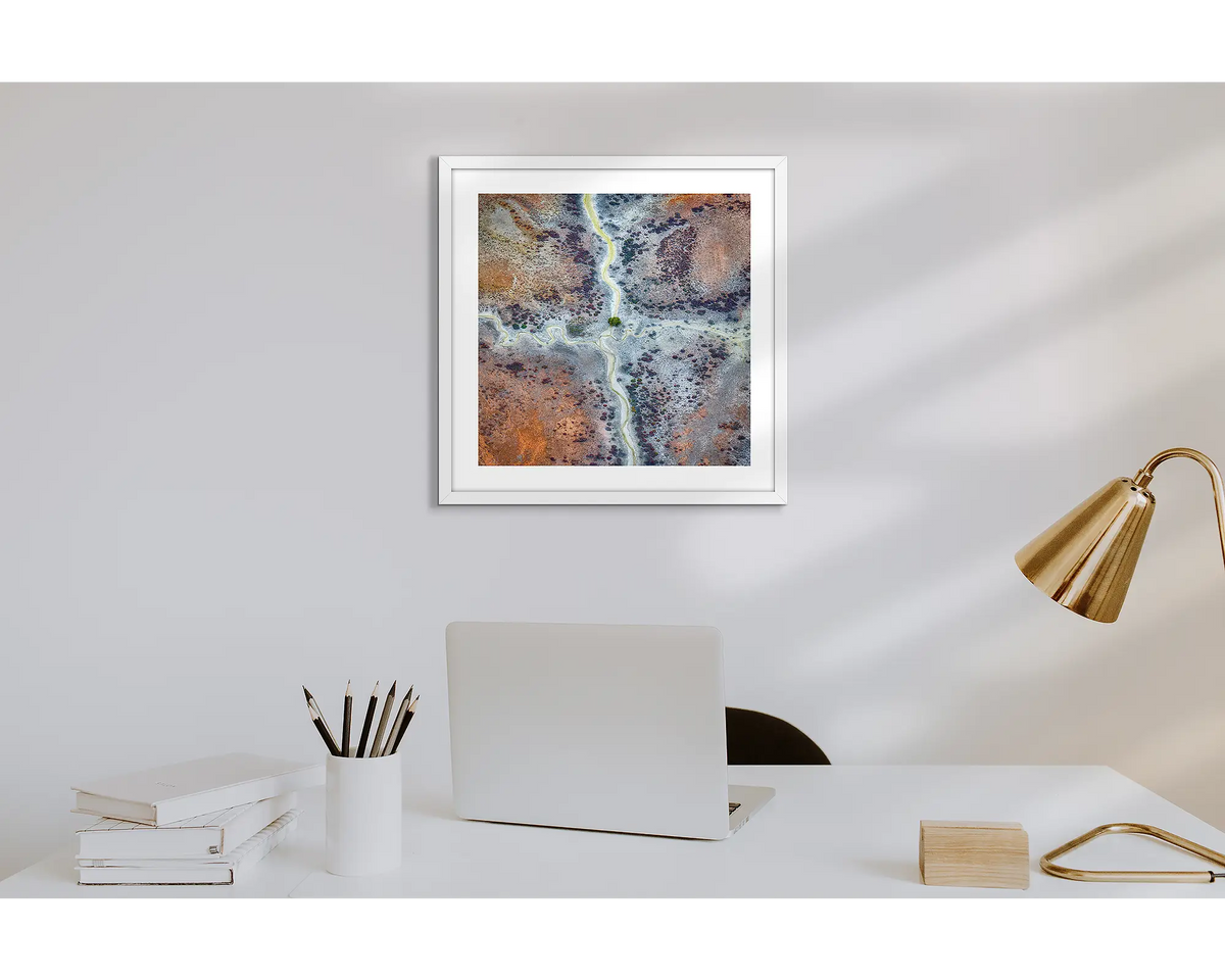 Crossroads. Wall art print of Kimberley abstract patterns, with a white frame in a work from home office.  