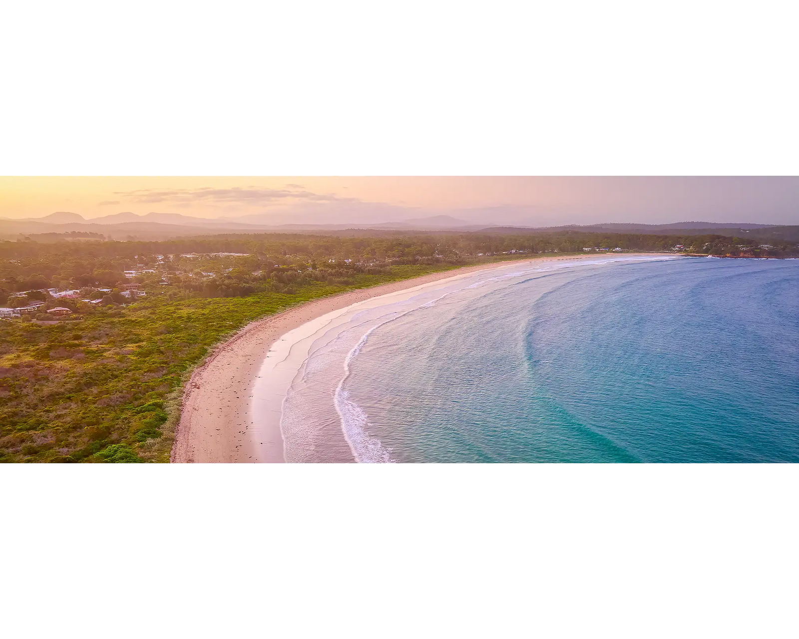 Curvature. Sunset at Broulee Beach, New South Wales south coast.