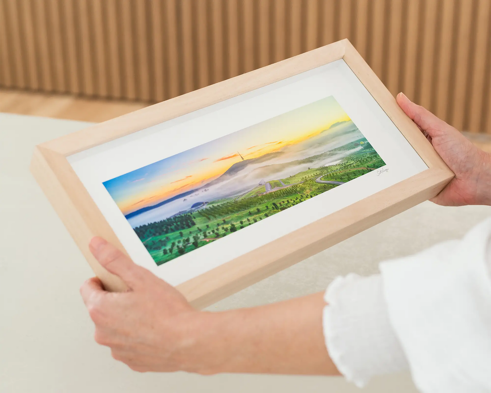 Photographic wall art print of a sunrise over the arboretum and Black Mountain above the mist. 