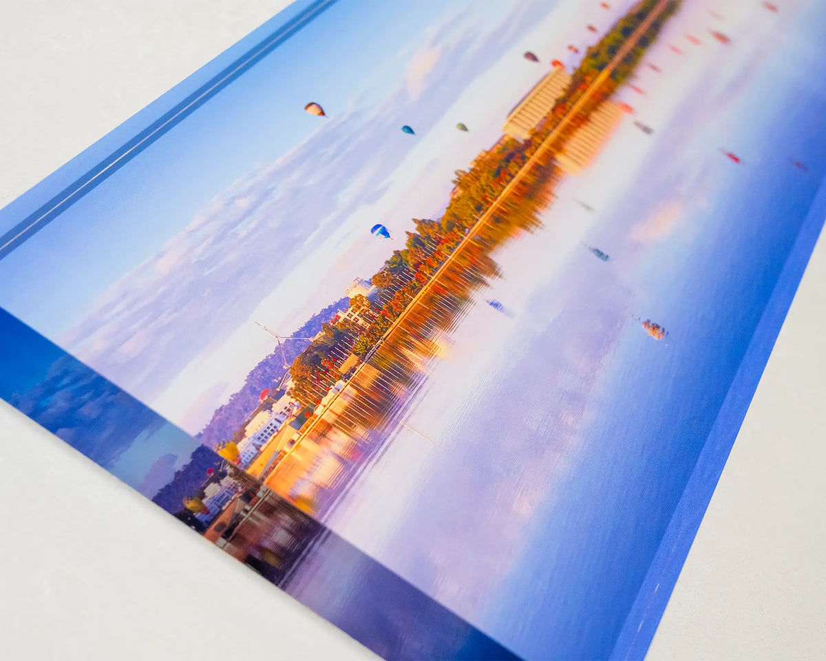Dawn Drifters. Acrylic block of hot air balloons over Lake Burley Griffin Canberra, laying flat showing 3 effect.