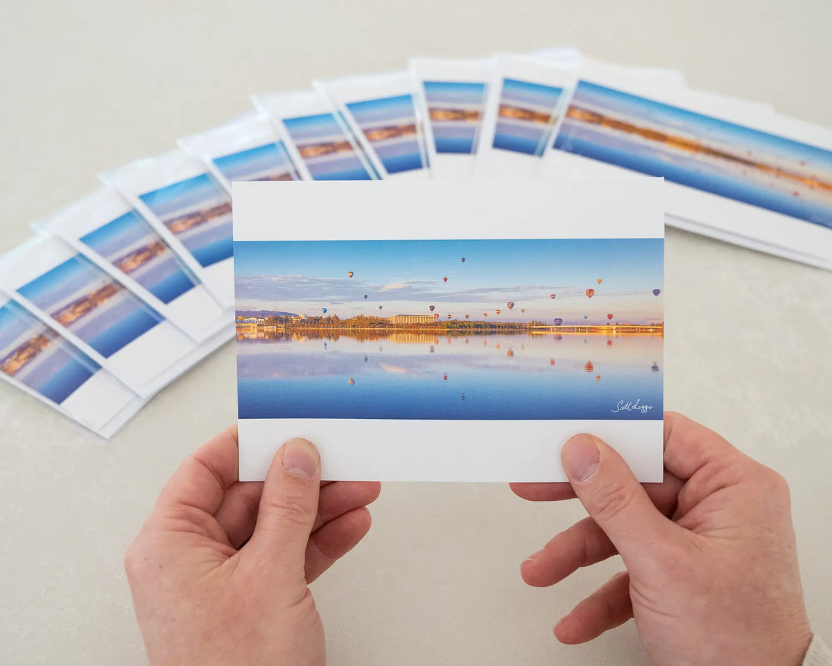 Dawn Drifters greeting card. Single card being held in front of ten pack of cards.