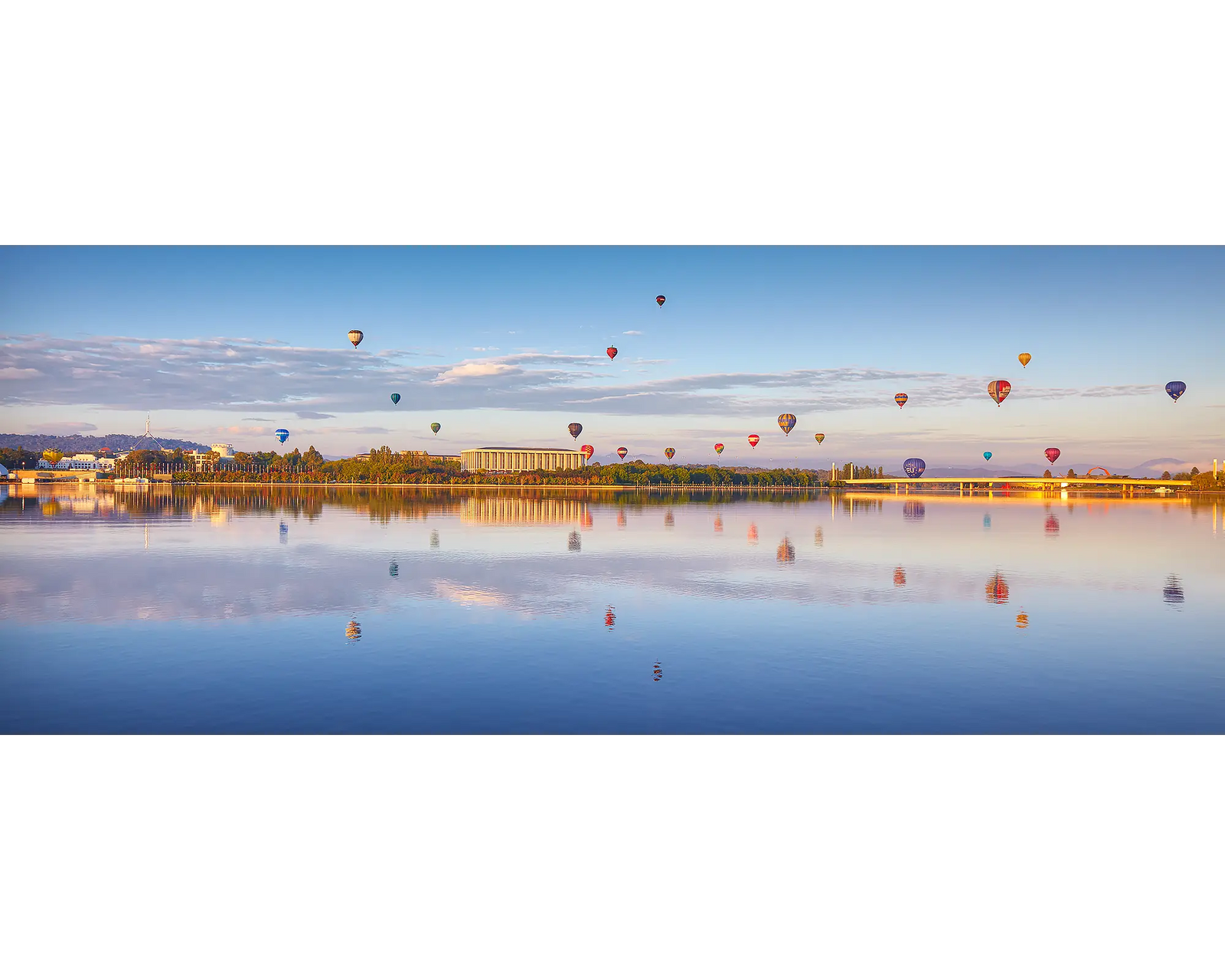 Dawn Drifters. Hot air balloons over Canberra at sunrise during Balloon Spectacular, Canberra.