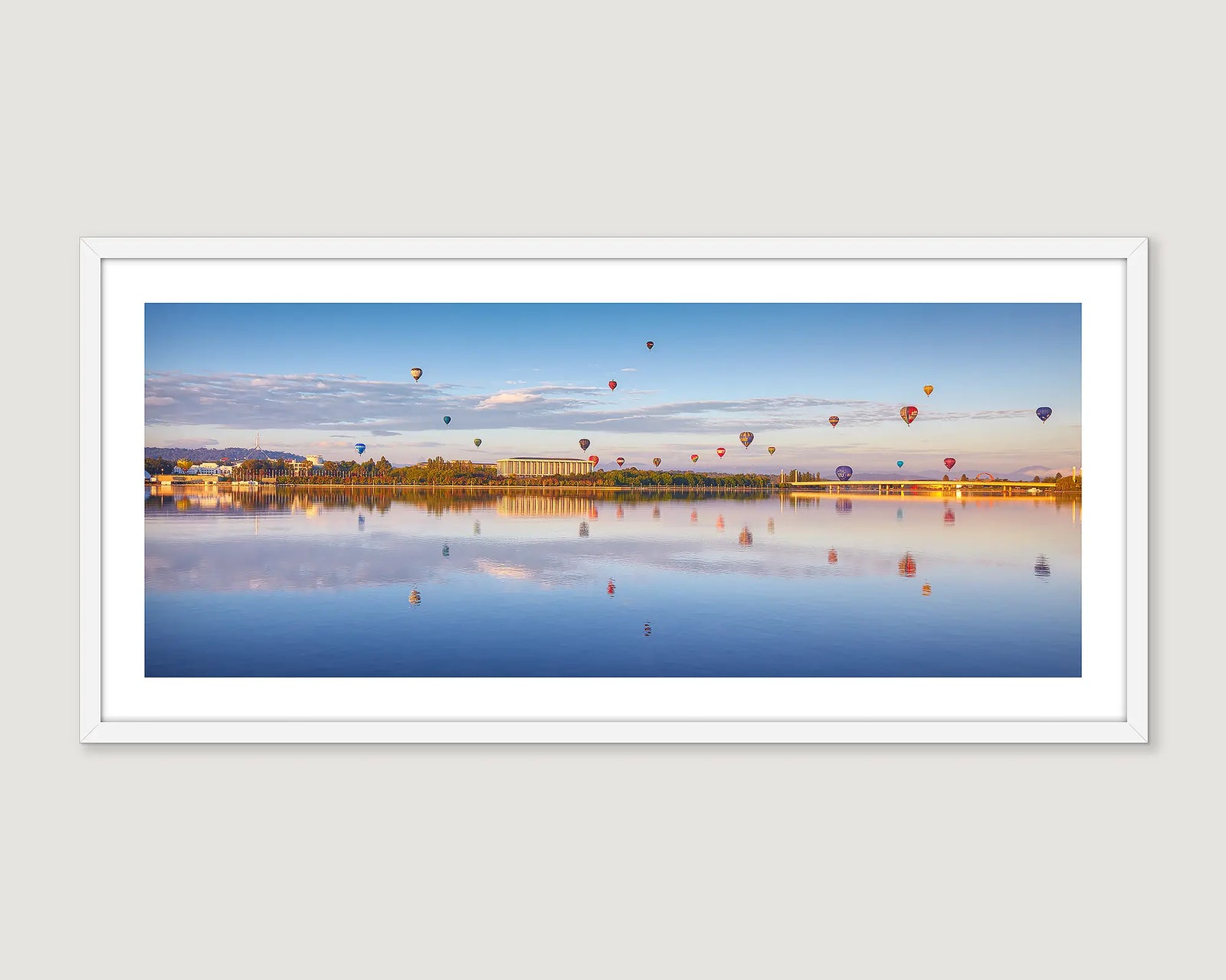Framed wall art print of hot air balloons over lake Burley Griffin at sunrise. 