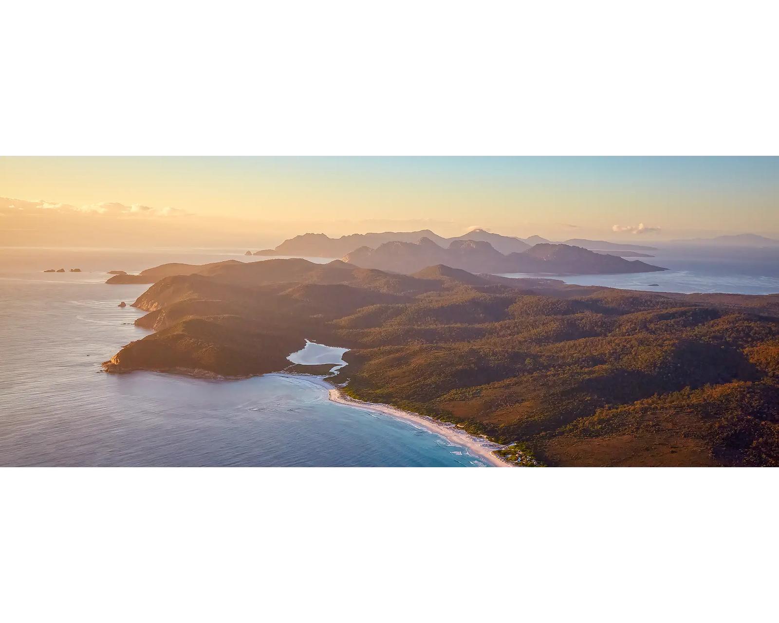 Dawn Over Freycinet. Sunrise over Freycinet National Park, viewed from the air. 