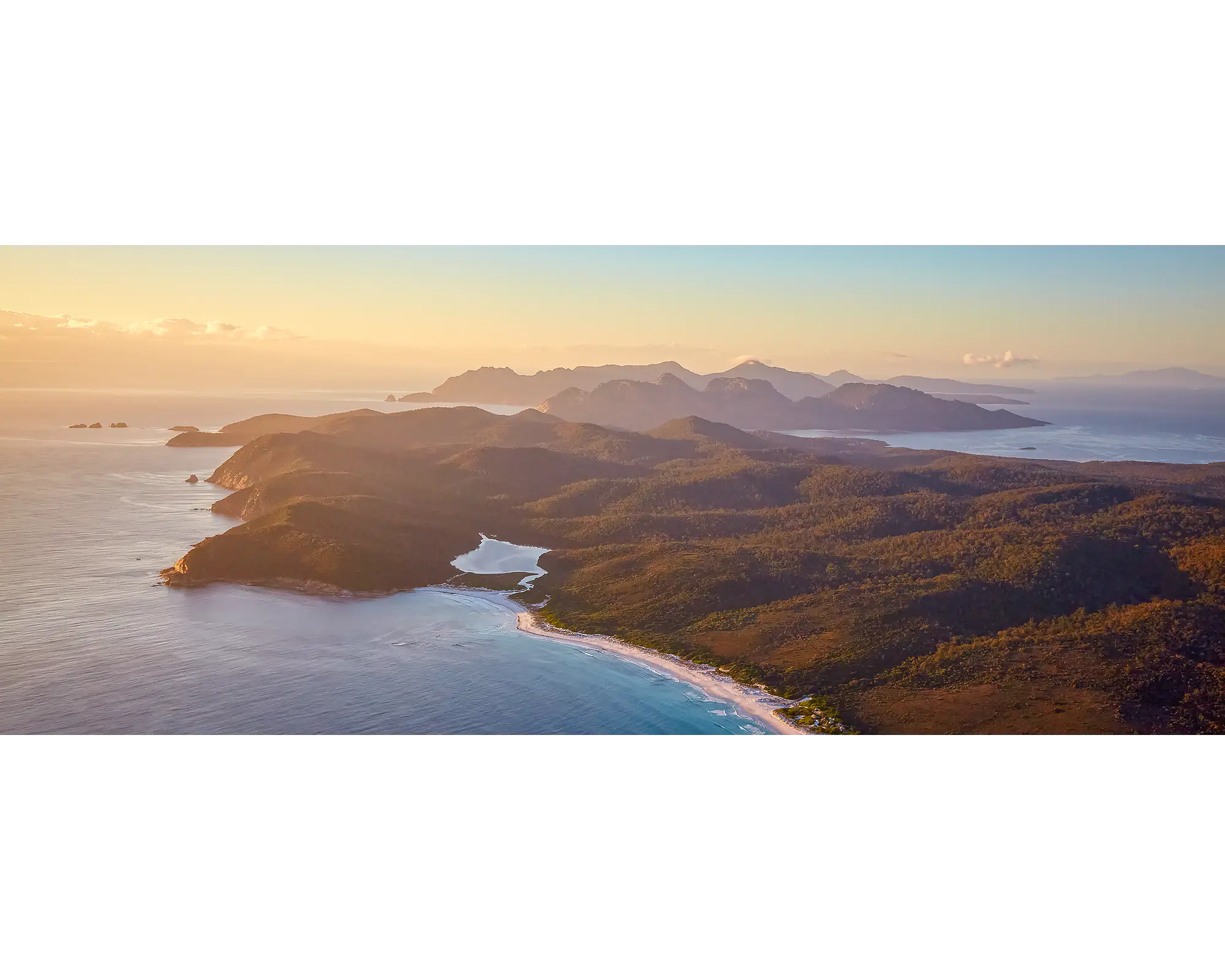 Dawn Over Freycinet. Sunrise over Freycinet National Park, viewed from the air. 