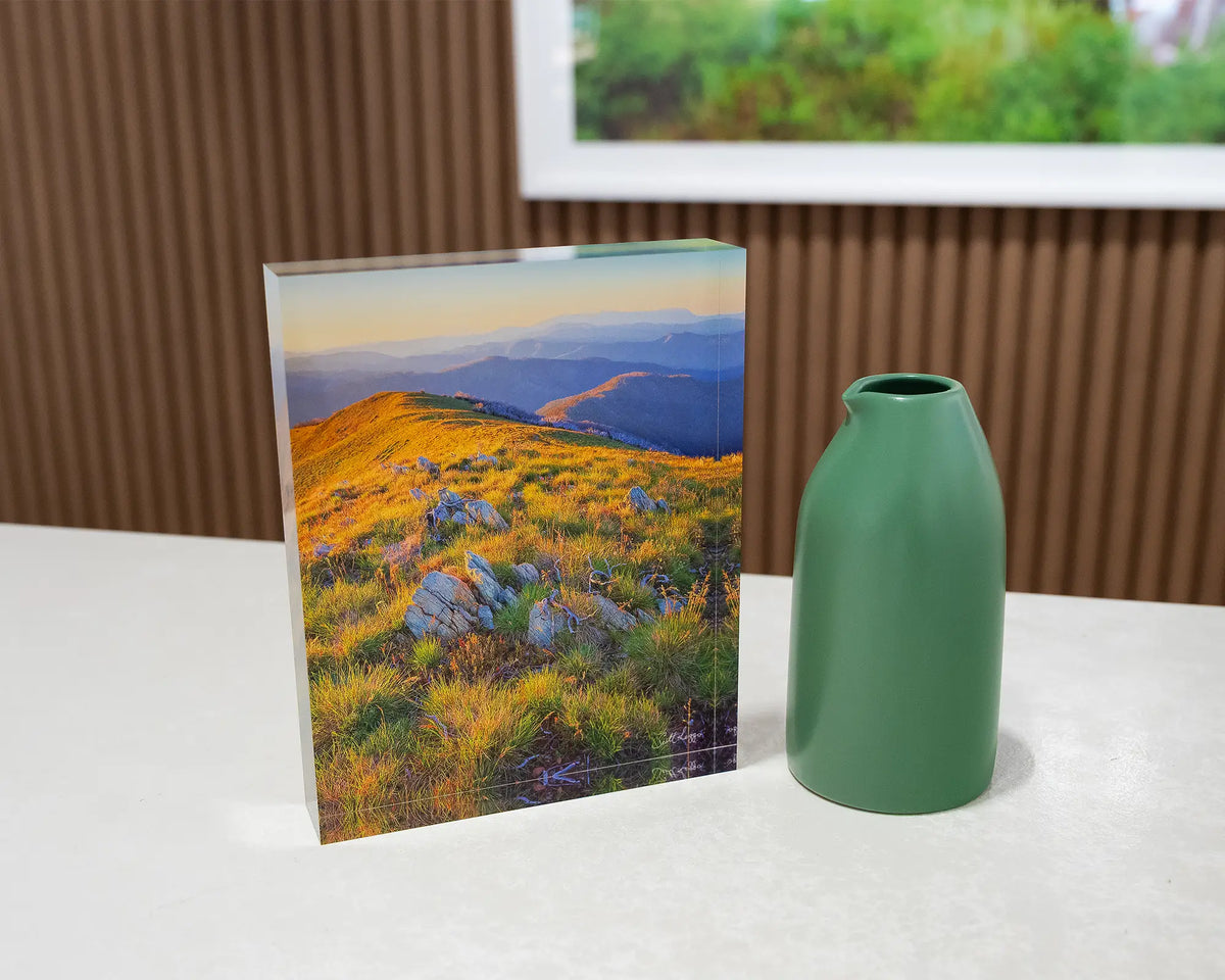 Days End. Acrylic block Alpine National Park Victoria, on desk styled with small vase.