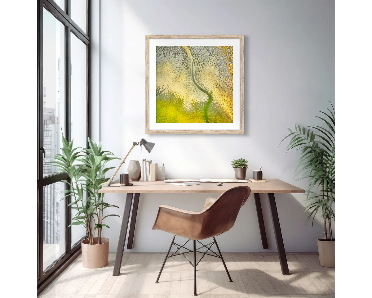 Dehydration. Framed wall art print of a dam drying out, viewed from above with a timber frame in a light filled apartment, hung above a desk.