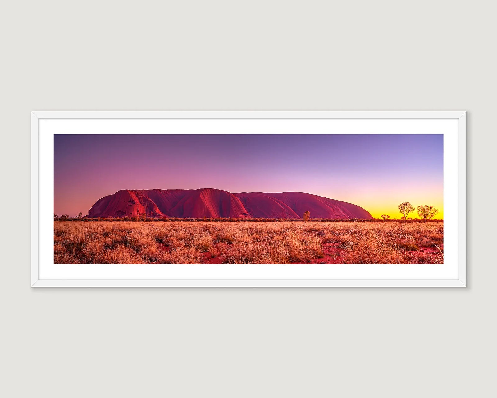 Framed wall art print of a sunrise over Uluru. 