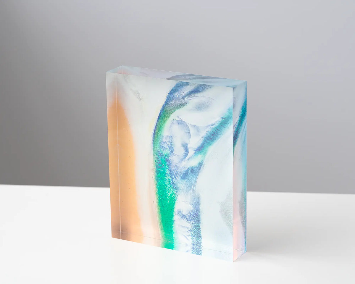 Displacement acrylic block sitting on a desk. 