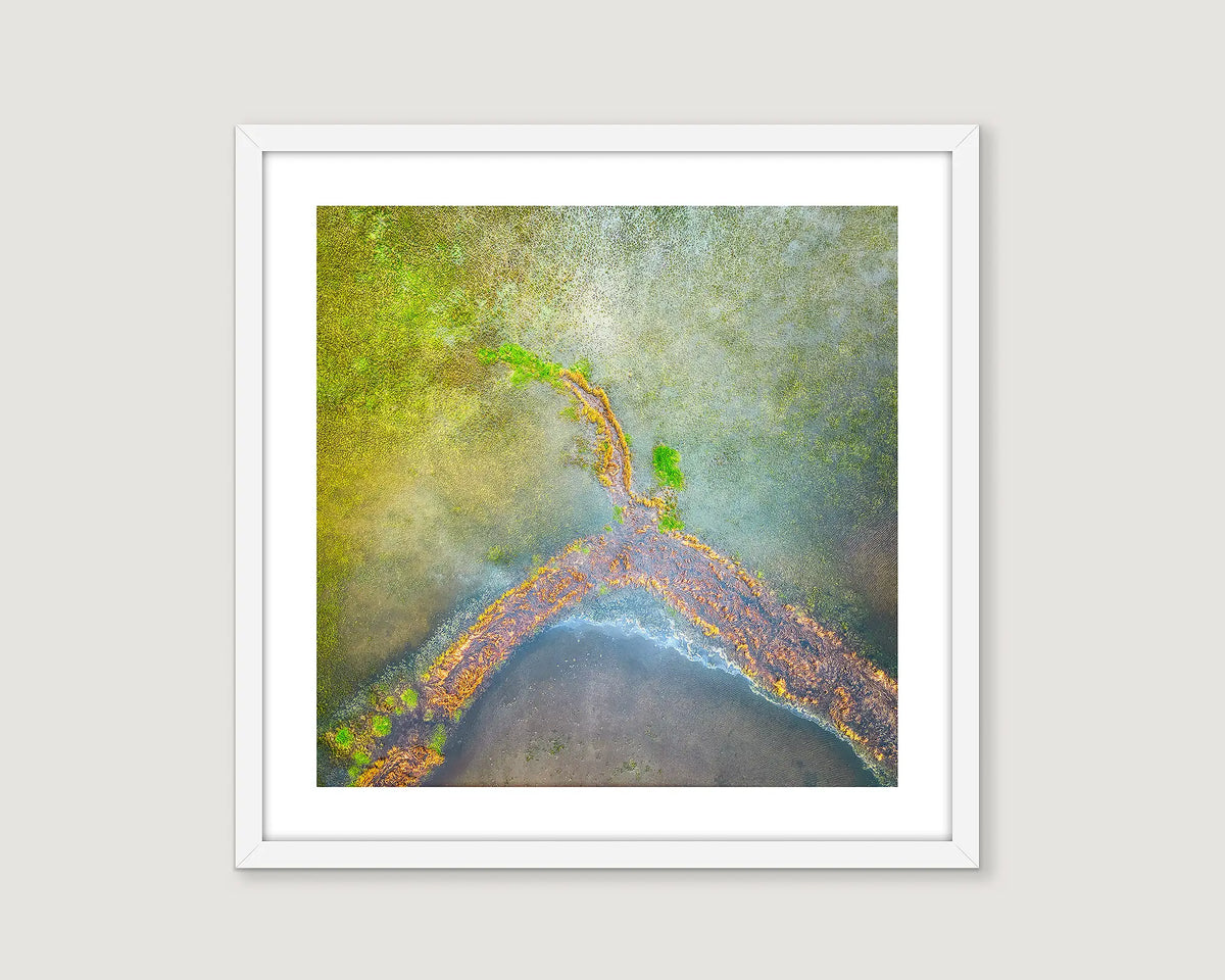 Framed abstract aerial print of patterns in Lake George after heavy rainfall. 