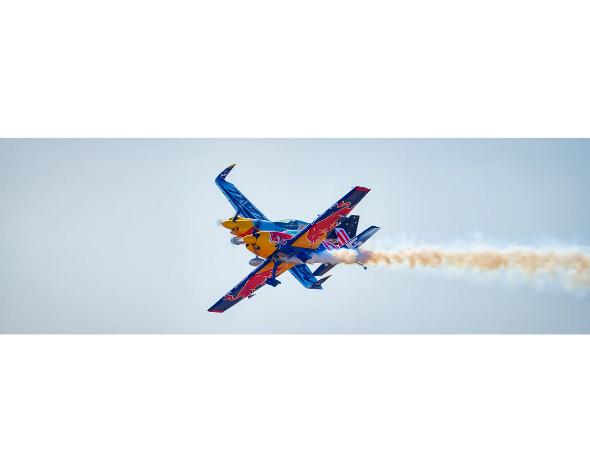 Double Trouble. Matt Hall Racing MXS-R and Emma McDonald Extra 300L aerobatic aircraft flying on close formation.