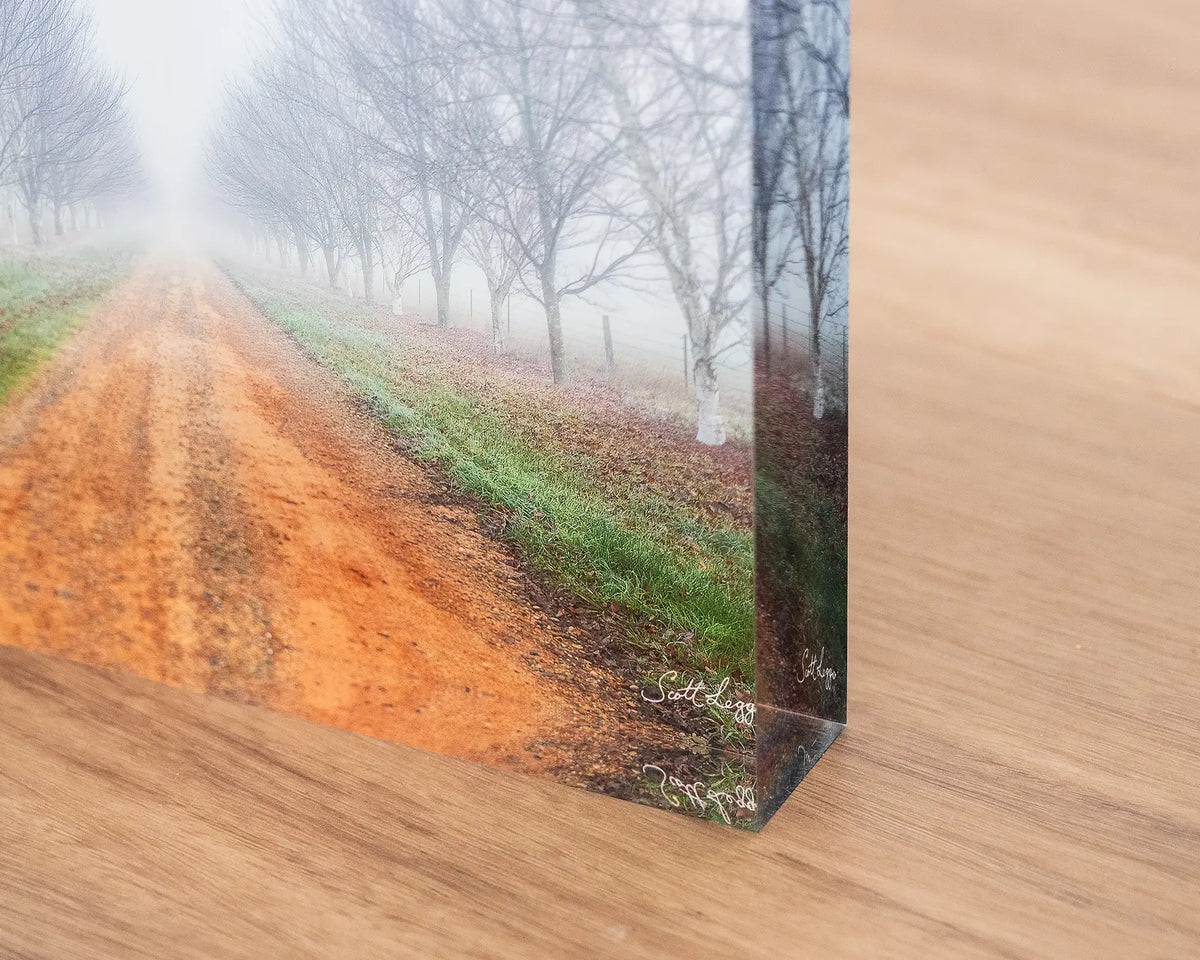 Down the Road. Acrylic block of a country driveway in fog, corner close-up detail.