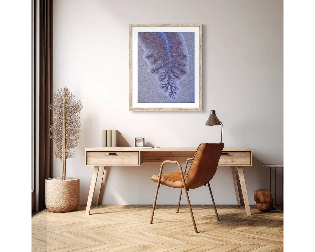 Downfall. Abstract Kimberley wall art print with a timber frame hanging above a desk in an apartment. 