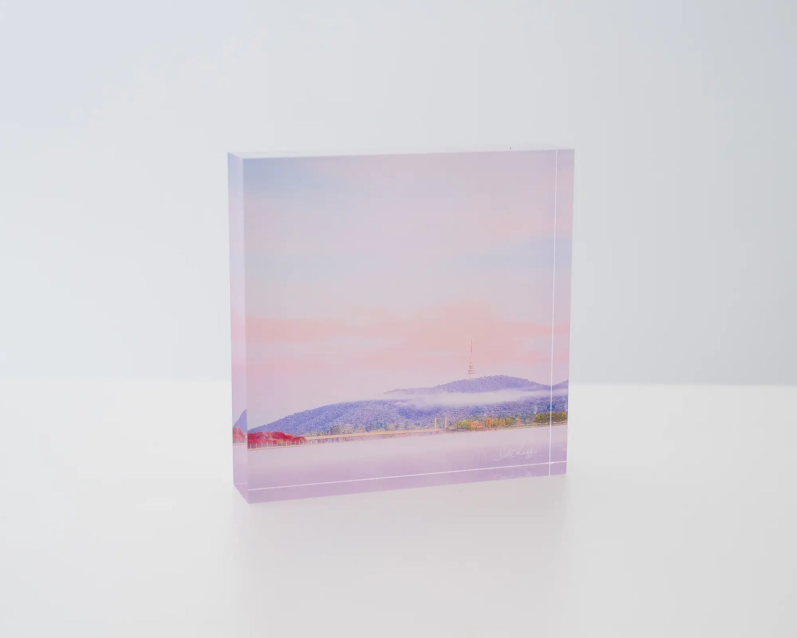 Dreamy Canberra. Acryic block soft pink sky over Lake Burley Griffin, Canberra.
