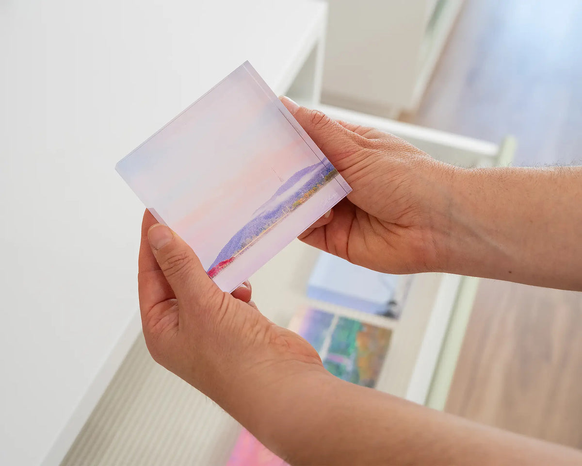 Dreamy Canberra. Acrylic block soft pink sky over Lake Burley Griffin, held in hands.