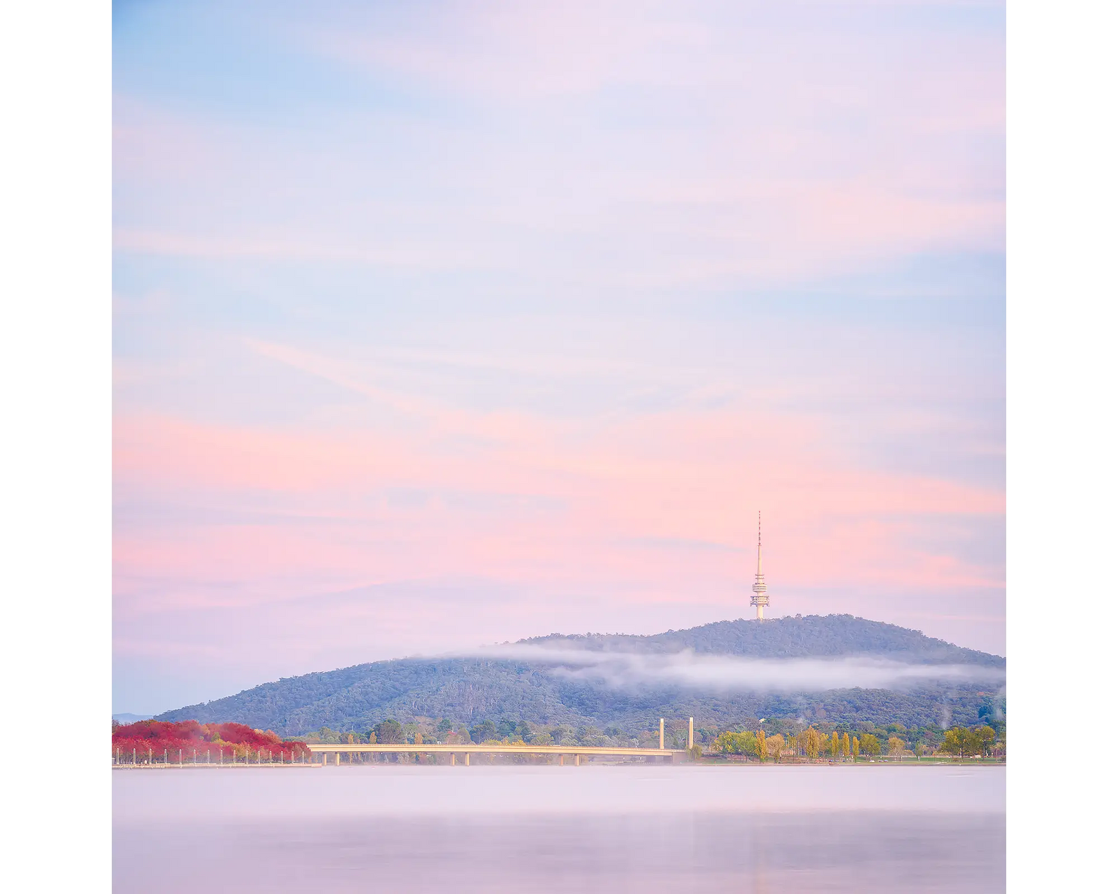 Dreamy Canberra. Morning sunrise with fog over Lake Burley Griffin.