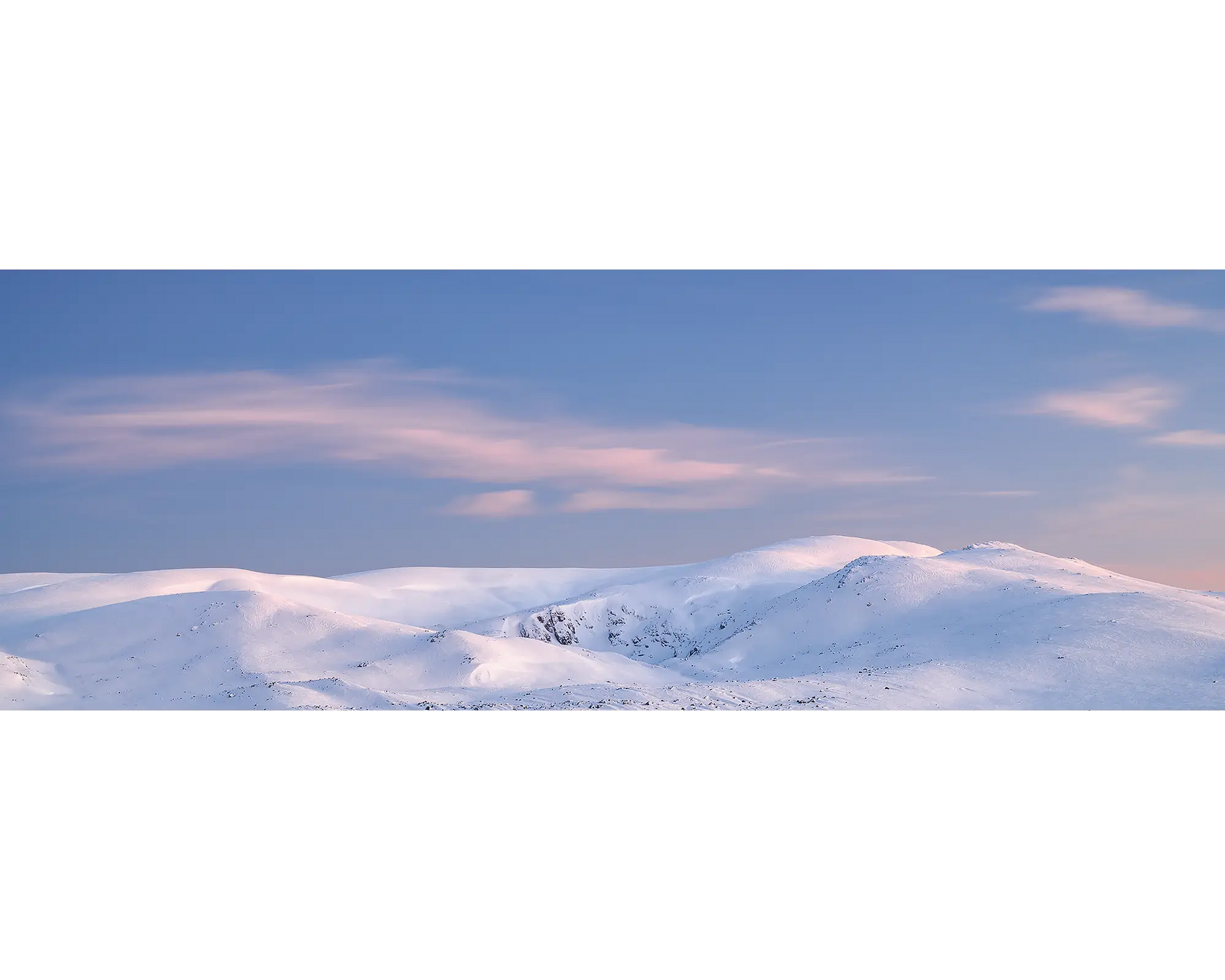 Sunrise over snow covered Mount Twynam and Blue Lake Kosciuszko National Park, NSW. 