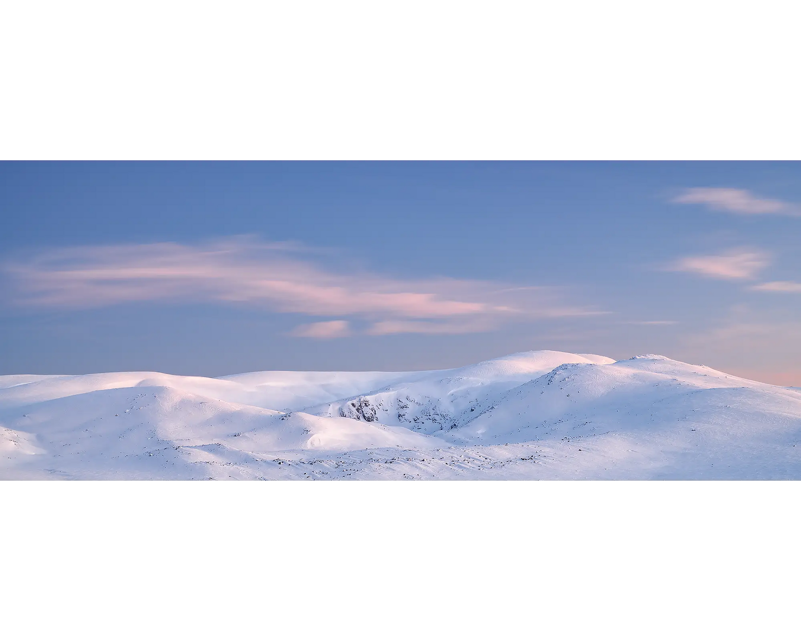 Early Morning. Sunrise over snow covered Mount Twynam and Blue Lake, Kosciuszko National Park, New South Wales, Australia.
