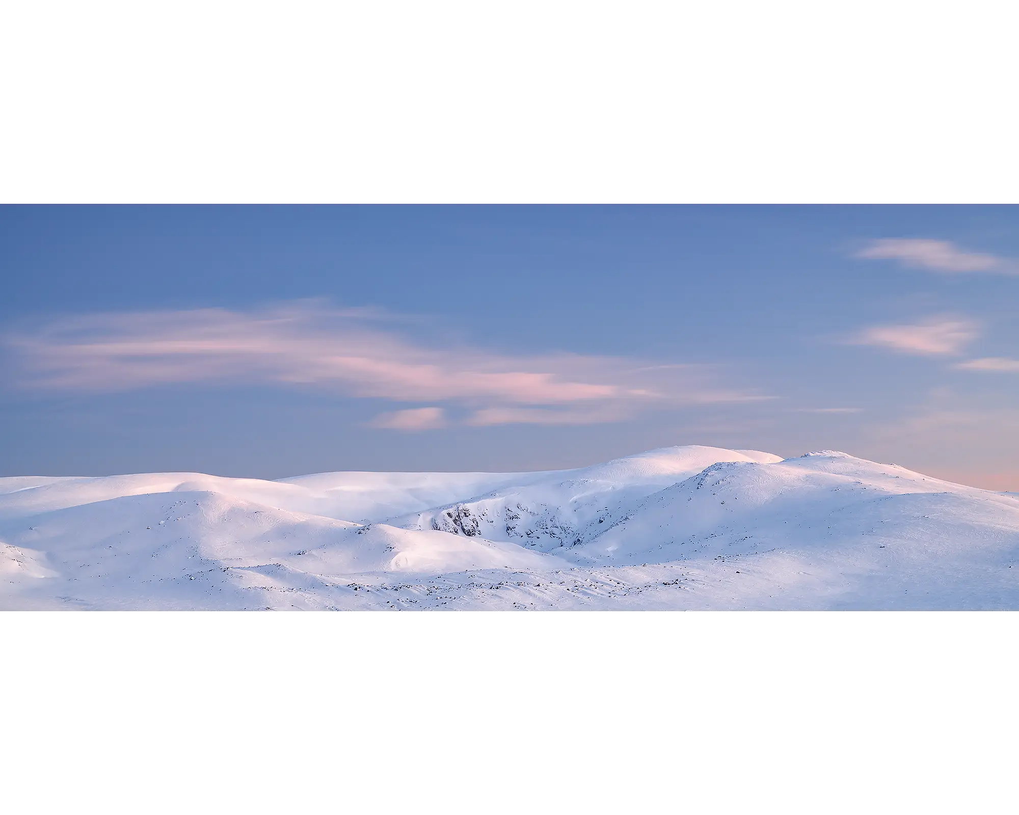 Early Morning. Sunrise over snow covered Mount Twynam and Blue Lake, Kosciuszko National Park, New South Wales, Australia.