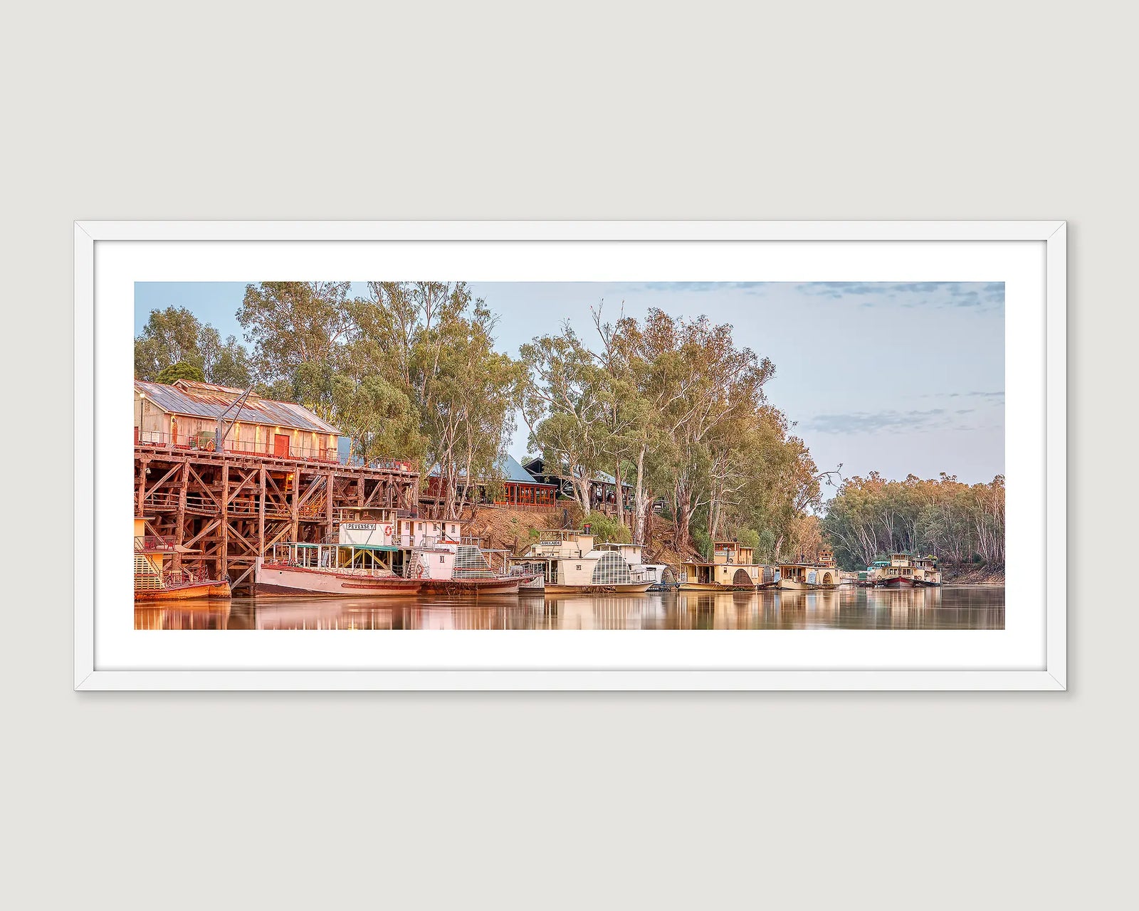 Framed wall art print of paddle boats moored at the Echuca Wharf on the Murray River at sunrise. 