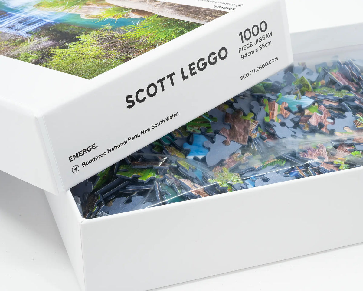 Emerge. 1000 piece jigsaw puzzle Buddaroo National Park, New South Wales, open box showing puzzle pieces.