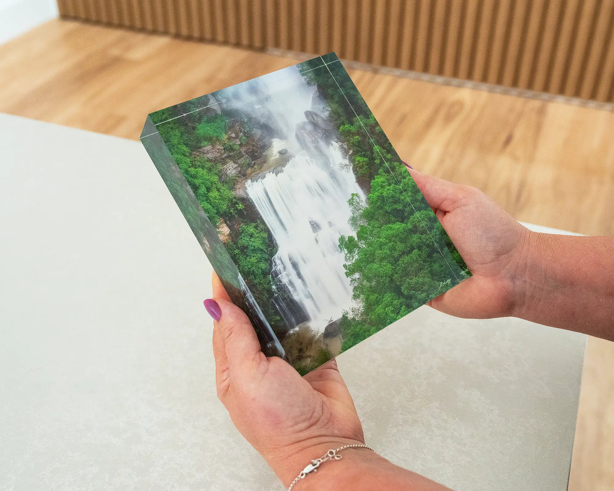 Energy. Acrylic block of Fitzroy Falls, Morton National Park, being held in hands.