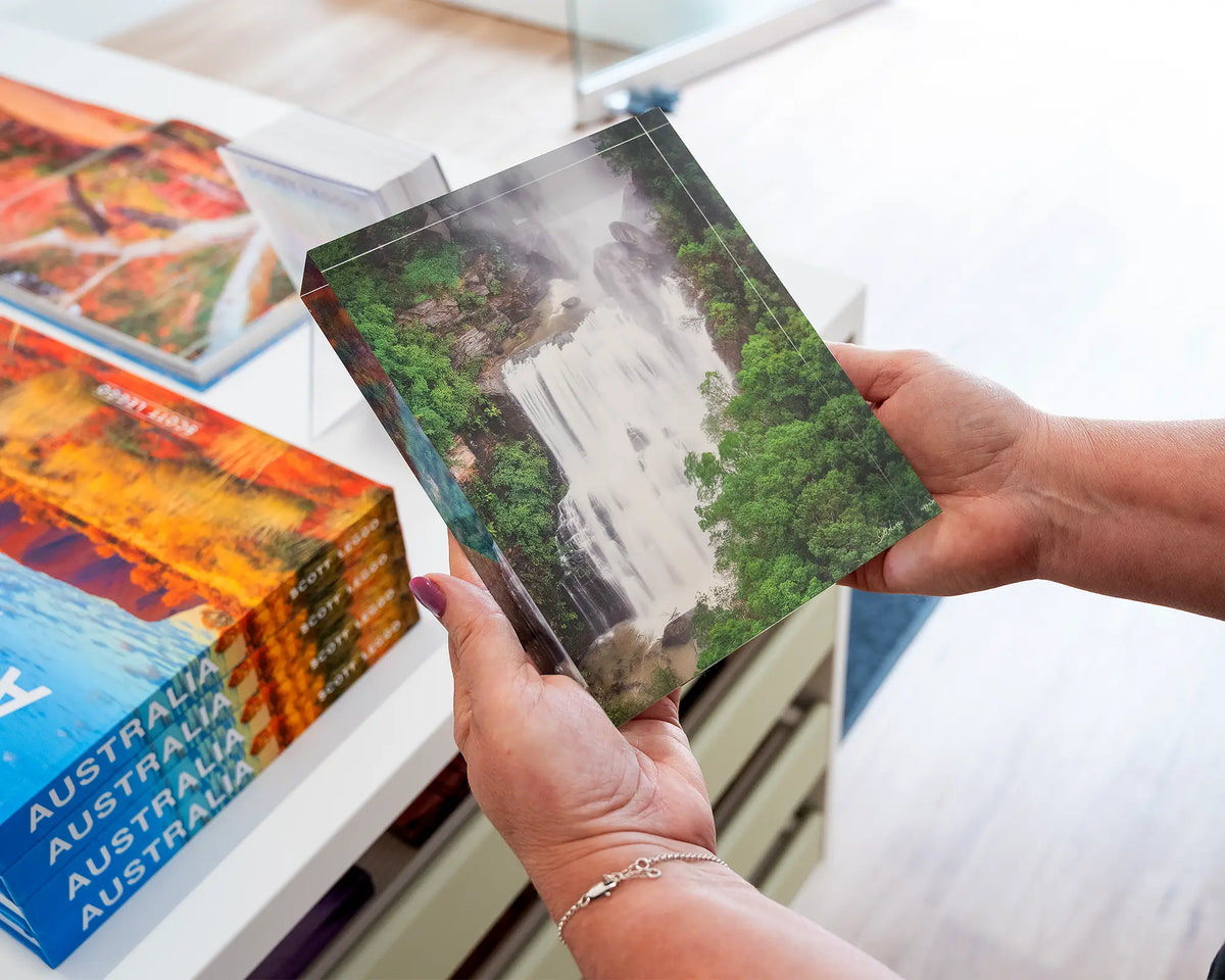 Energy. Acrylic block of Fitzroy Falls, Morton National Park, held in hands.
