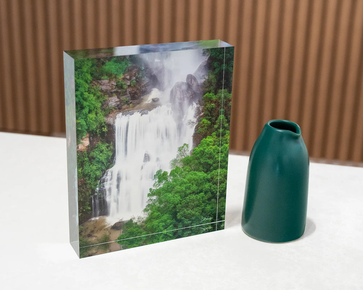 Energy. Acrylic block Fitzroy Falls, Morton National Park, on gallery desk with small vase.
