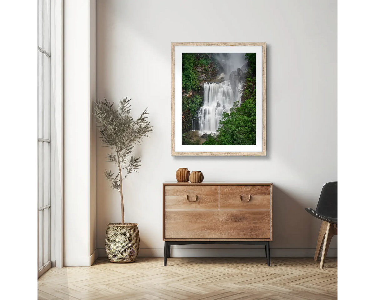 Energy. Fitzroy Falls photographic wall art print with a Tassie Oak frame, hung in a scandi hallway. 