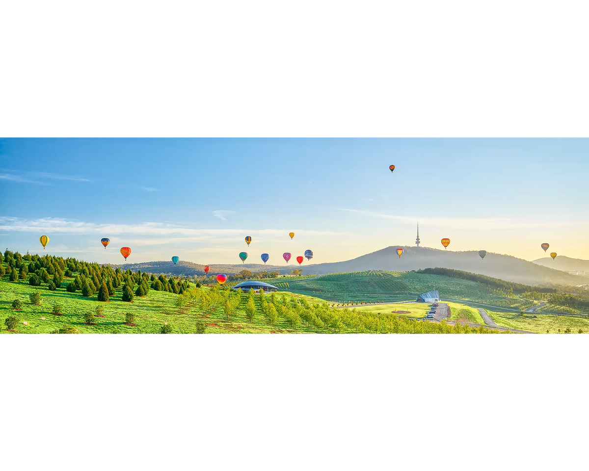 Enlighten - Balloons at sunrise over National Arboretum during Balloon Spectacular Enlighten Festival, Canberra.