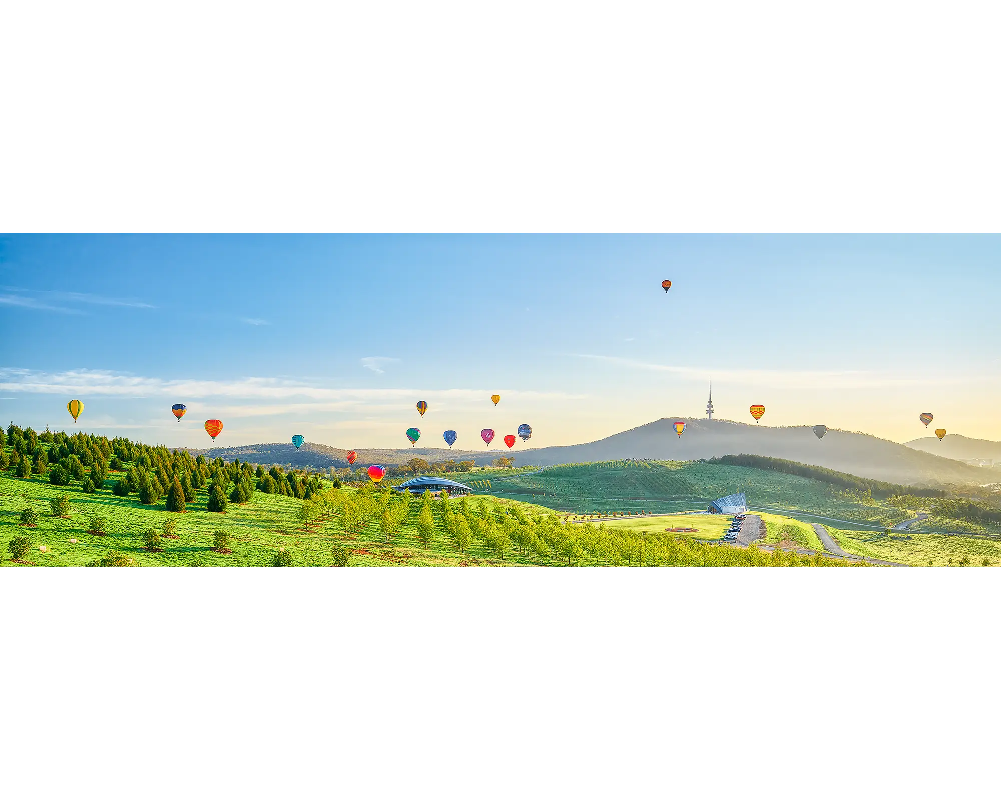 Enlighten - Balloons at sunrise over National Arboretum during Balloon Spectacular Enlighten Festival, Canberra.