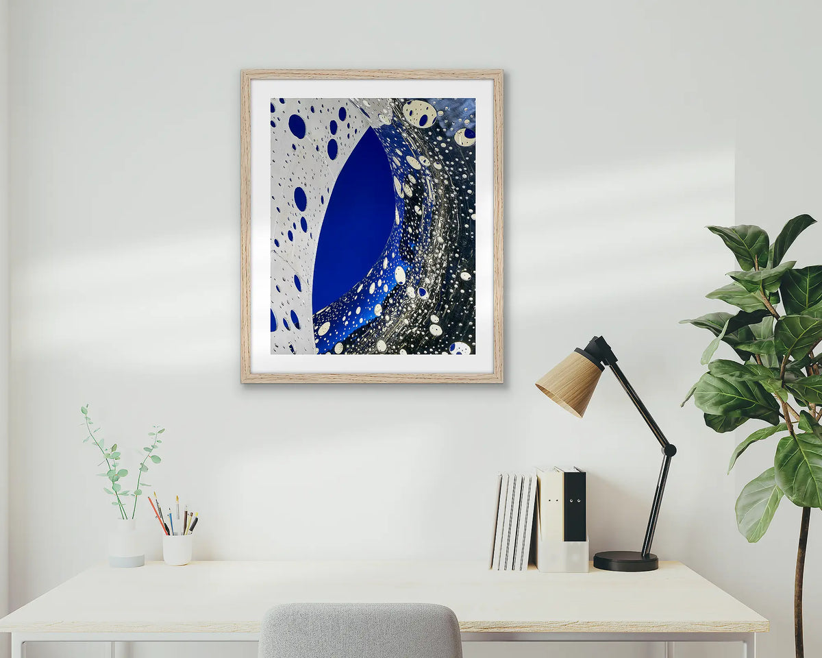 Entwine. Wall art print of the Ouroboros sculpture, framed in a Tasmanian Oak frame, and hung above an office desk. 