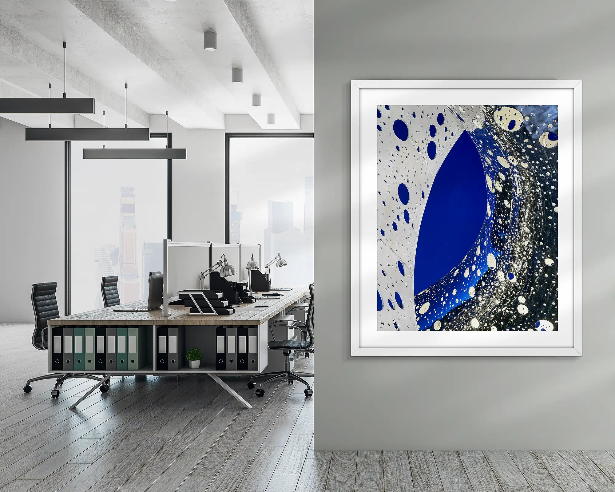 Entwine. Wall art print of the Ouroboros sculpture, framed in a white frame, and hung in a corporate office hallway. 