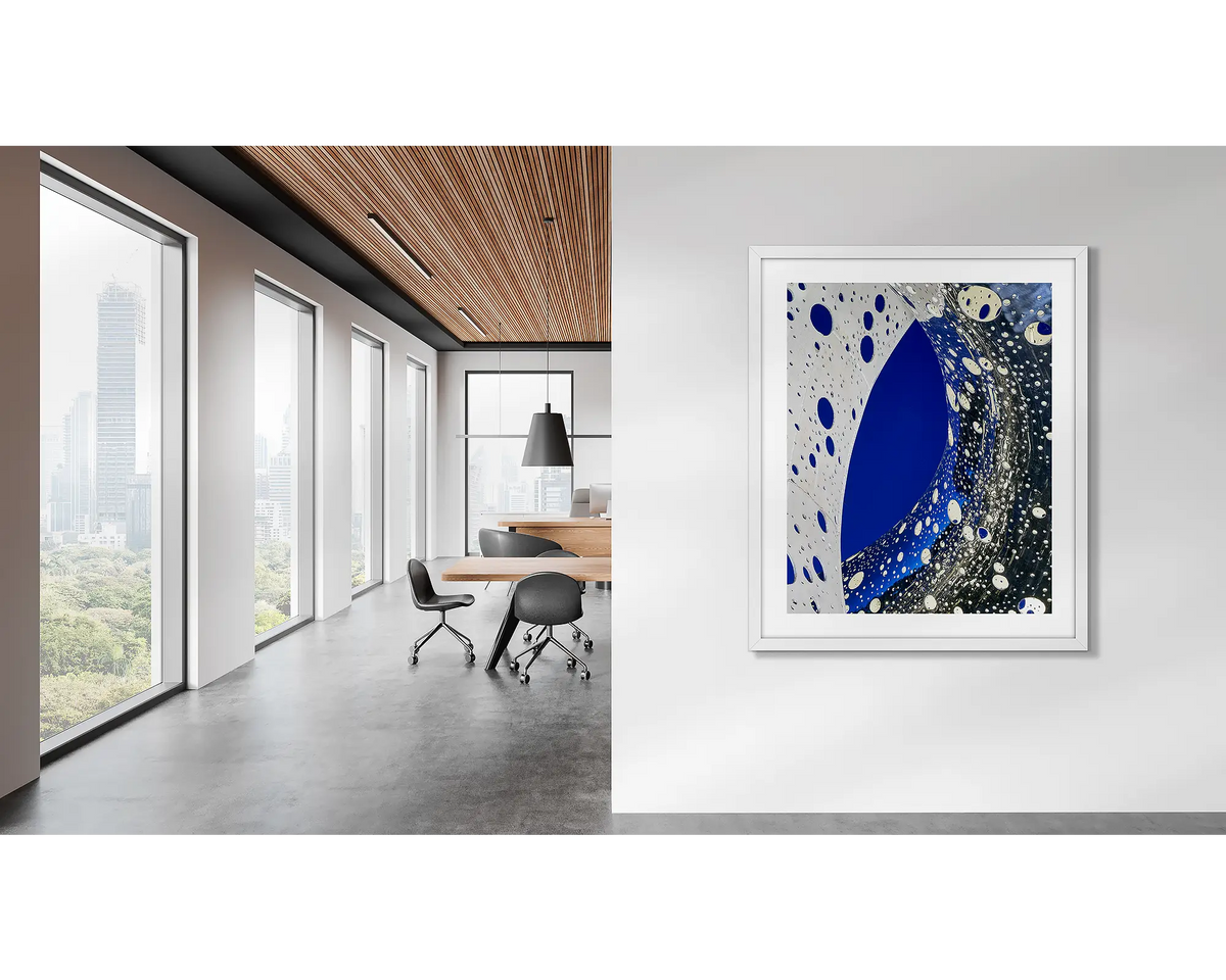 Entwine. Wall art print of the Ouroboros sculpture, framed in a white frame, and hung in a corporate office. 