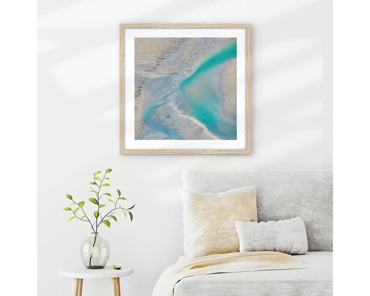 Escape. Abstract Kimberley wall art in a timber frame, hanging on a bedroom wall.