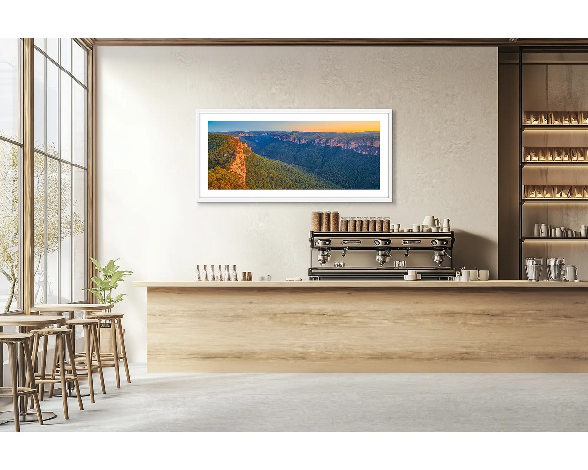 Escape from the City. Blue Mountains wall art print with a white frame hung in a cafe. 
