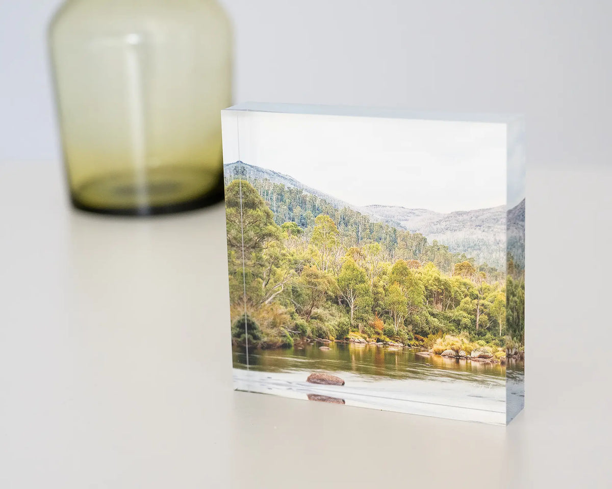 Escape to Nature. Acrylic block Thredbo River Kosciuszko National Park, on desk with vase.