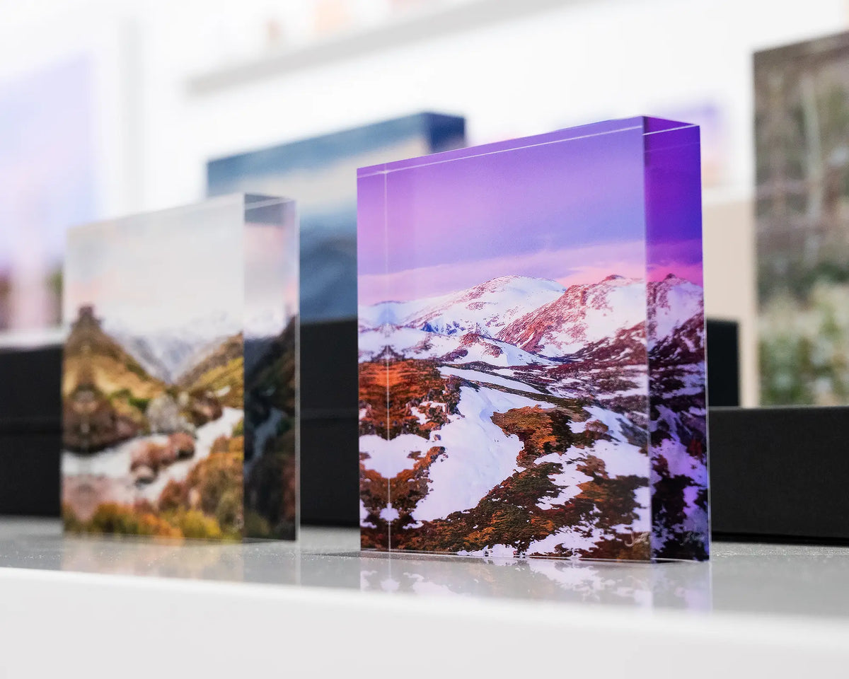 Escape To The Mountains. Acrylic block of sunset over Kosciuszko National Park, displayed in gallery with alpine acrylic blocks.