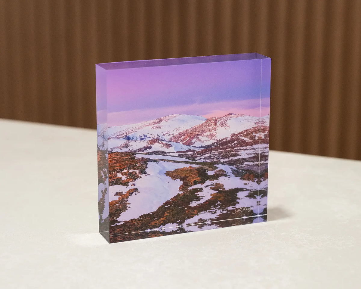 Escape To The Mountains. Acrylic block of sunset over Kosciuszko National Park, sitting on desk.
