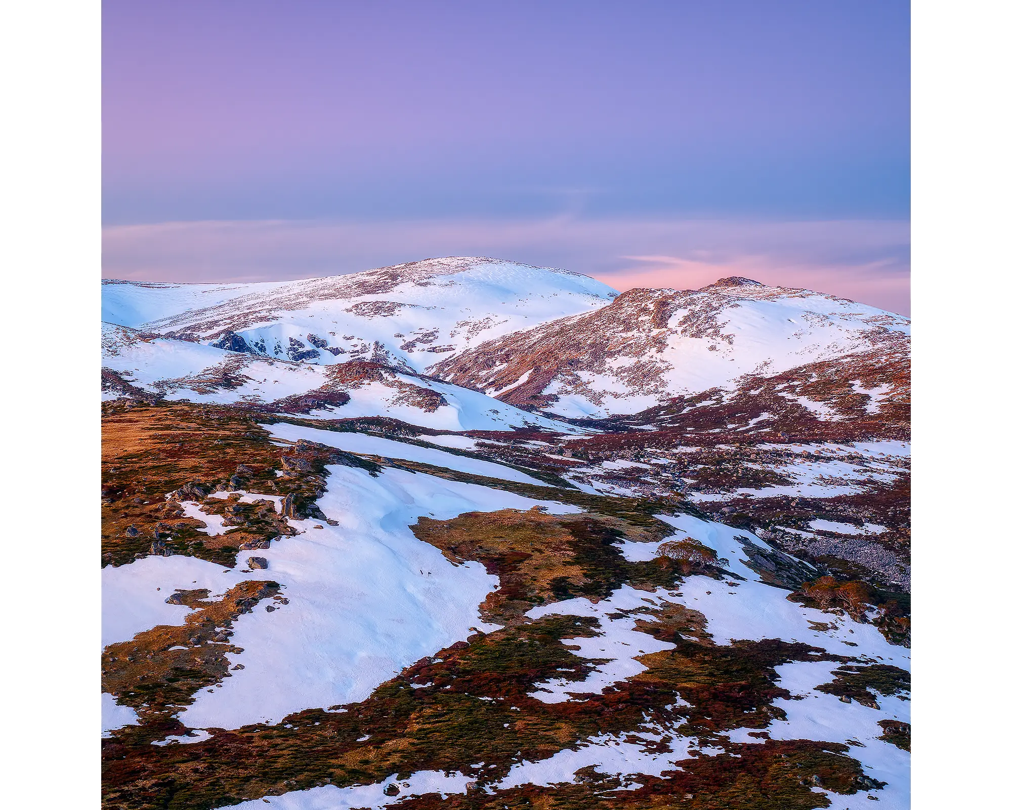 Snow melting on Mount Twynam at sunset. Kosciuszko National Park, NSW.