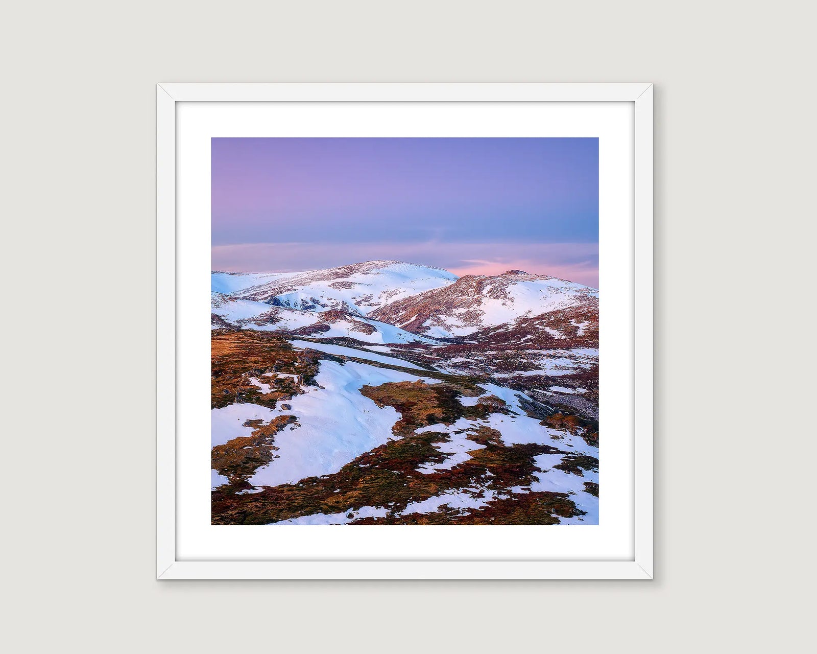 Framed wall art print of a sunset on Mount Twynam, partially covered in snow. 