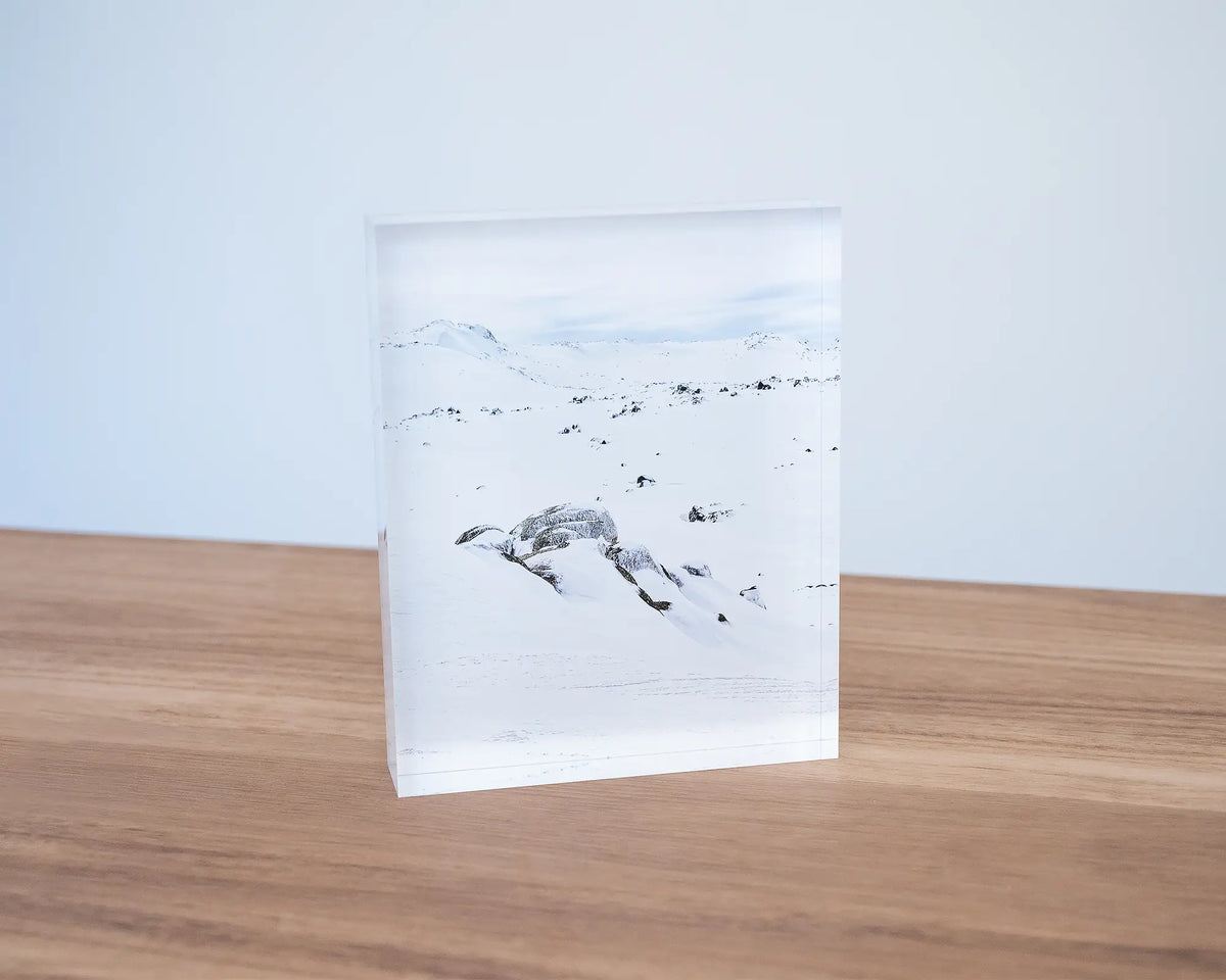 Etheridge Lines. Acrylic block Kosciuszko National Park, Rams Head Range, sitting on a desk.