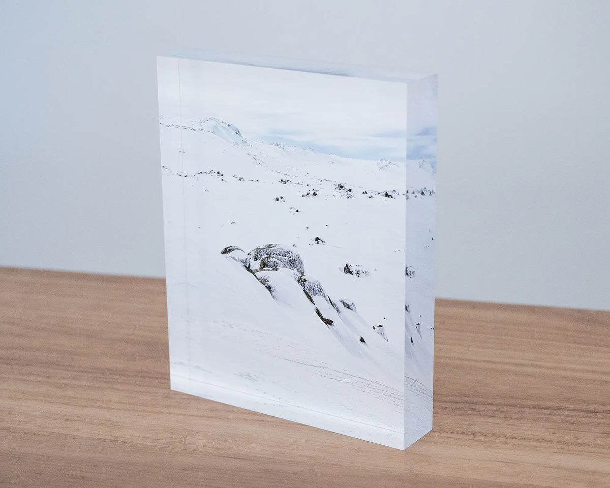 Etheridge Lines. Acrylic block Rams Head Range, Kosciuszko National Park, sitting on a desk.