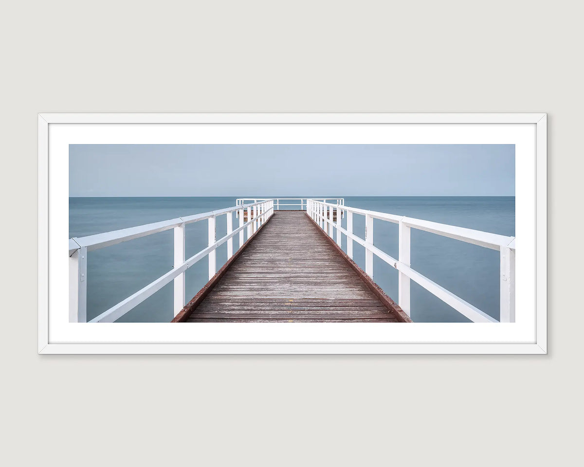Framed wall art print of a timber pier looking out to the ocean at Scarness Jetty, Hervey Bay. 