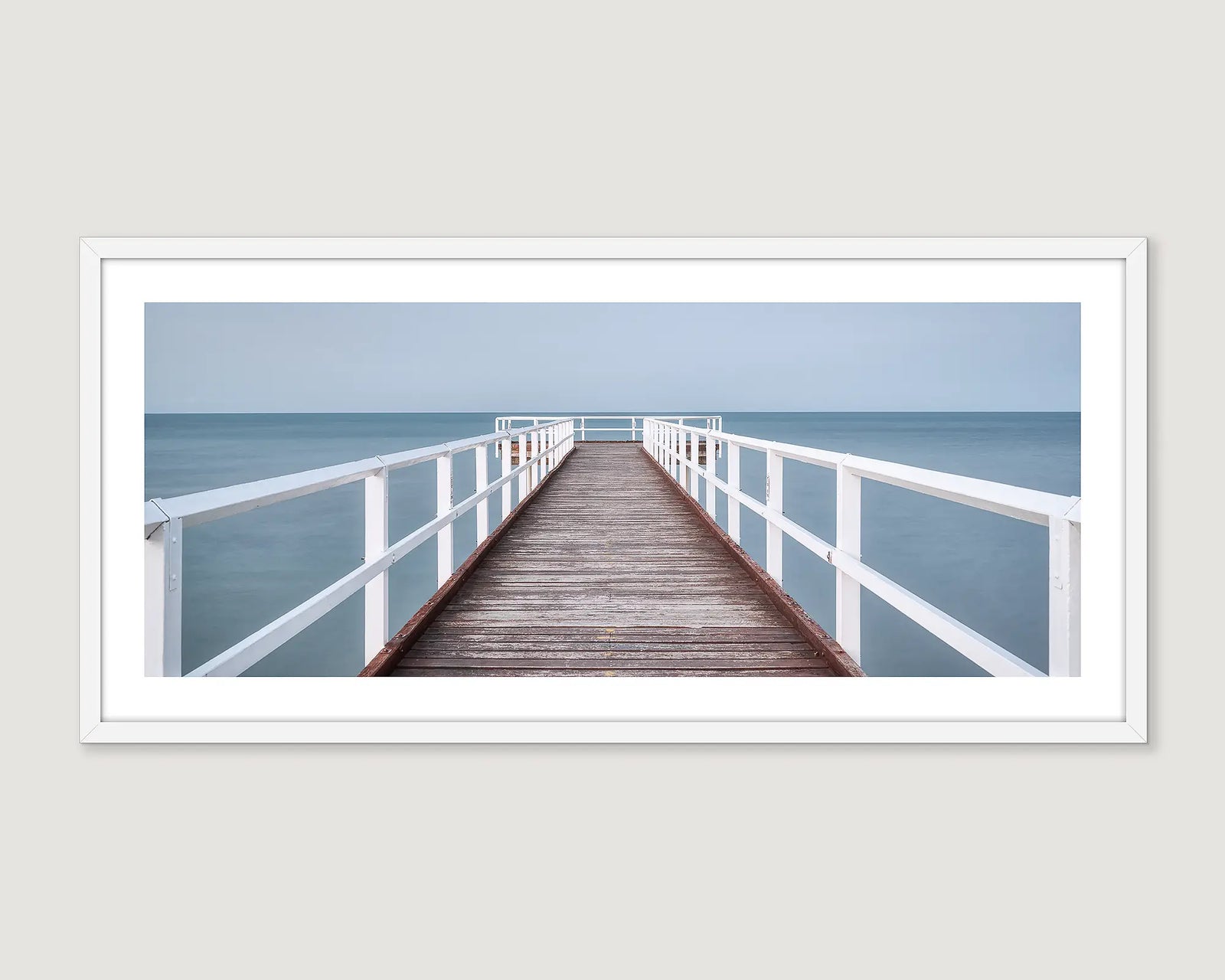 Framed wall art print of a timber pier looking out to the ocean at Scarness Jetty, Hervey Bay. 