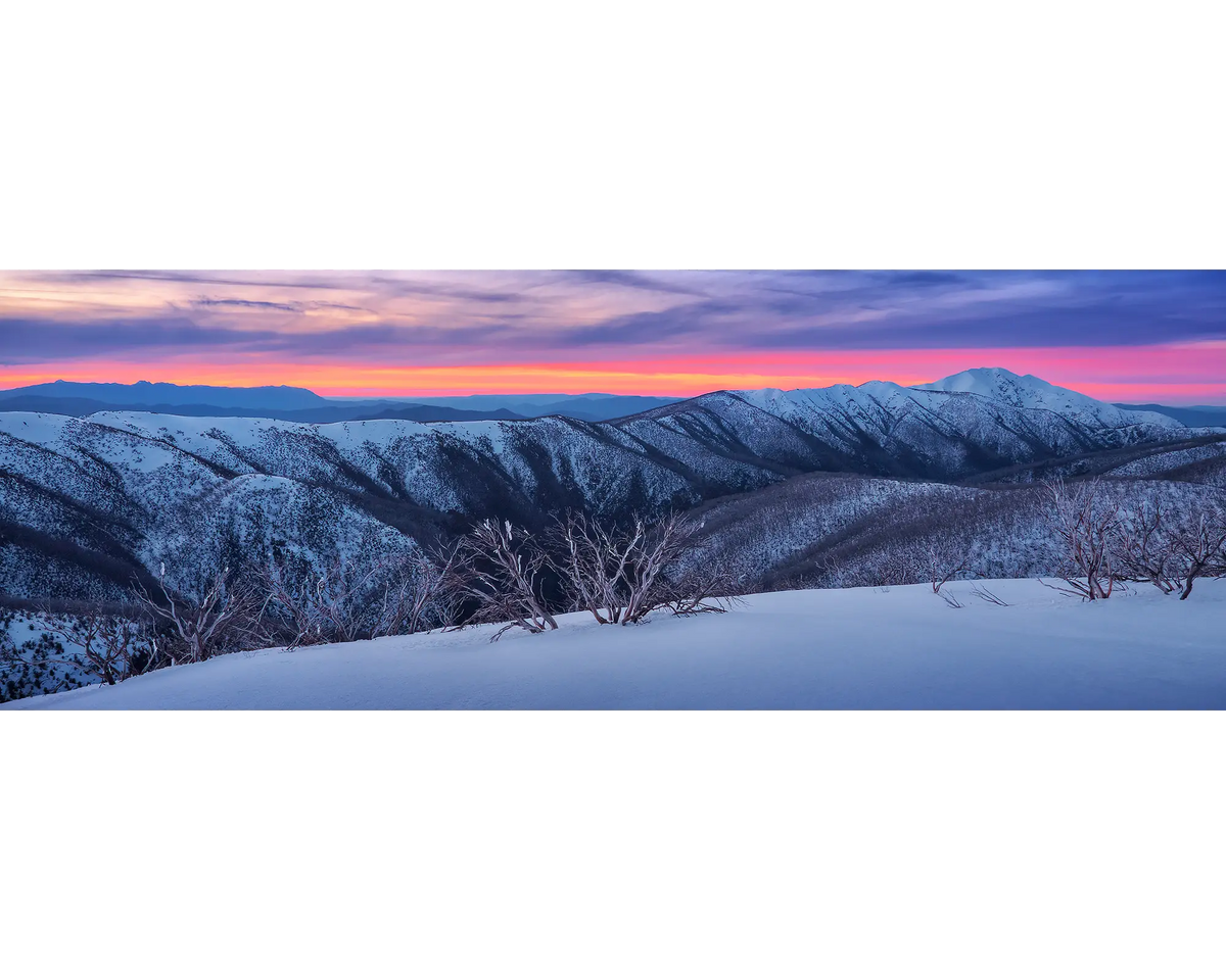 Sunset over the Razorback and Mount Feathertop covered in snow, Alpine National Park, Victoria. 
