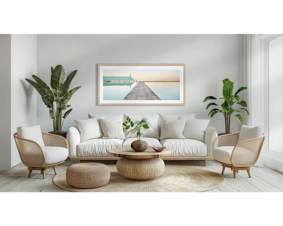 Evening Swim. Newcastle coastal wall art in a Tasmanian Oak frame, in a lounge room.